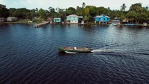 A boat exploring homes on the coast of Honduras