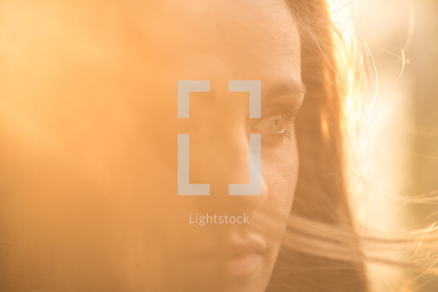 profile of a woman glowing in the sunlight 
