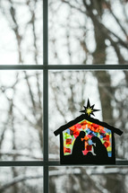 stained glass children's craft of the nativity scene in a window 