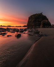 Camel Rock on a beach at sunset 
