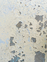 distressed texture, peeling paint on concrete surface in neutral colors