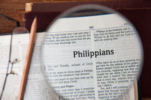 magnifying glass over Philippians 