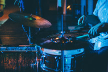 drummer at a drum set on stage 