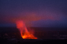 erupting volcano at sunset 