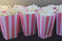 a table full of popcorn for youth movie night