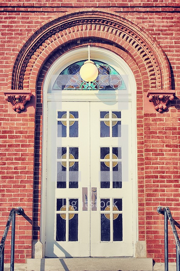 church doors with stained glass windows 