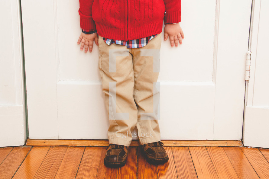 feet and legs of a toddler boy in dress clothes 