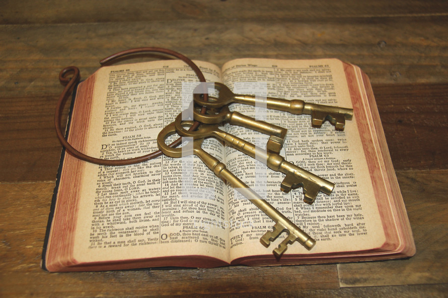 skeleton key on the pages of a Bible 