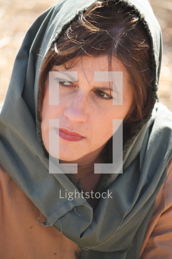 Woman wearing a head scarf.