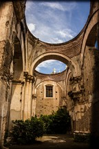 arches and blue sky in a Guatemala cathedrals courtyard 