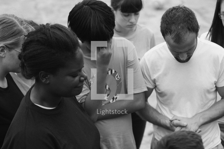 a group of missionaries in prayer