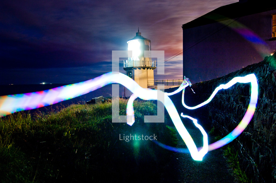 light from a lighthouse and streaks of light 