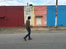 a man walking down a street 