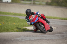 motorcycle taking a sharp turn