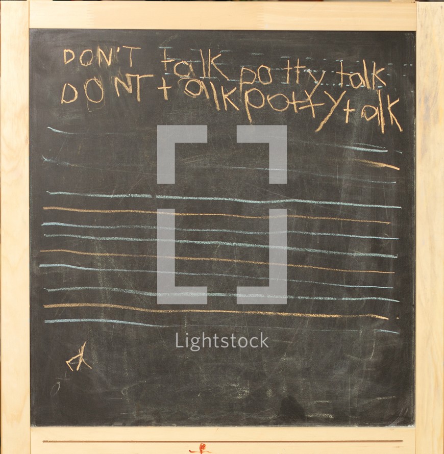 A chalk board with the phrase 'Don't talk potty talk' written on it