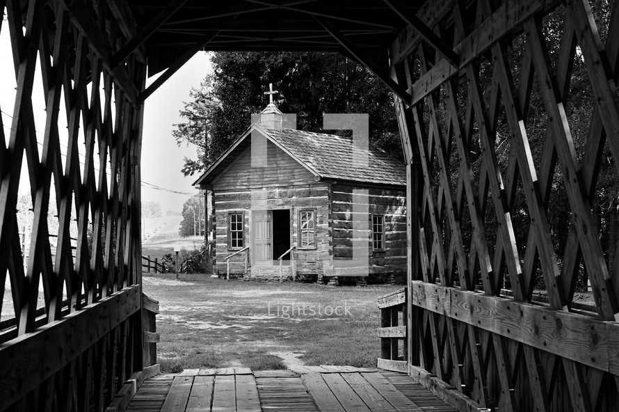 covered bridge and old log cabin chapel 