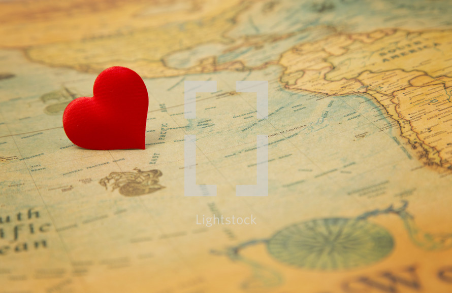 A love heart on an old vintage map - Do you love the world?