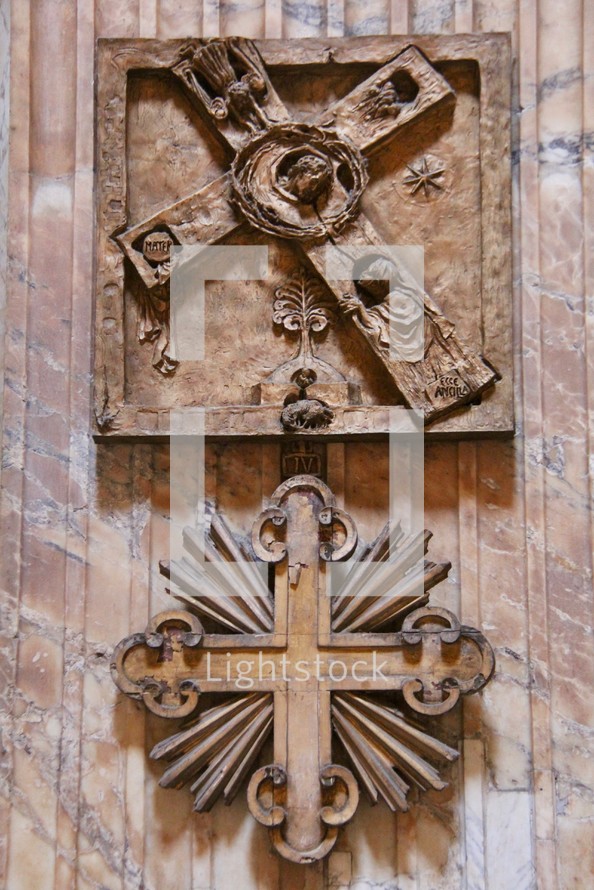 wooden cross and crown of thorns on a door 
