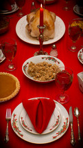 turkey in  the center of a set table 