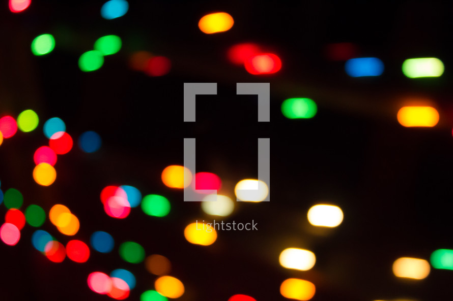 colorful bokeh lights against black 