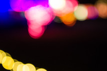 colorful bokeh lights against black 