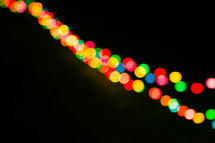 colorful bokeh lights against black 