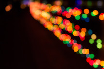 colorful bokeh lights against black 