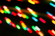 colorful bokeh lights against black 