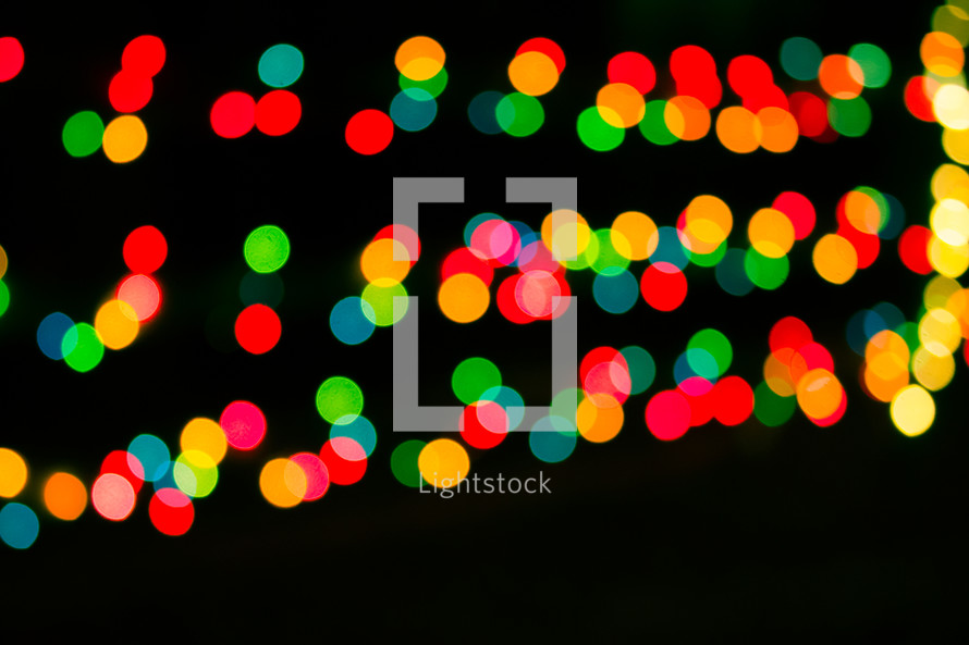 colorful bokeh lights against black 
