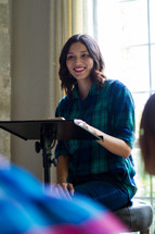 woman leading a group Bible study discussing scripture 