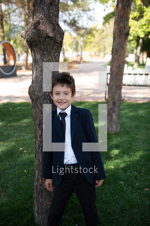 portrait of a boy in dress clothes 