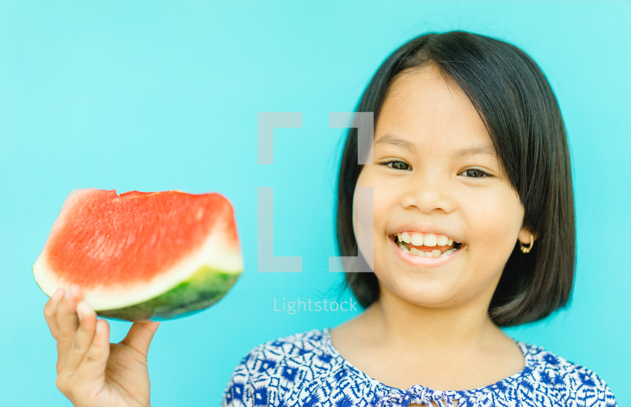 child eating watermelon 