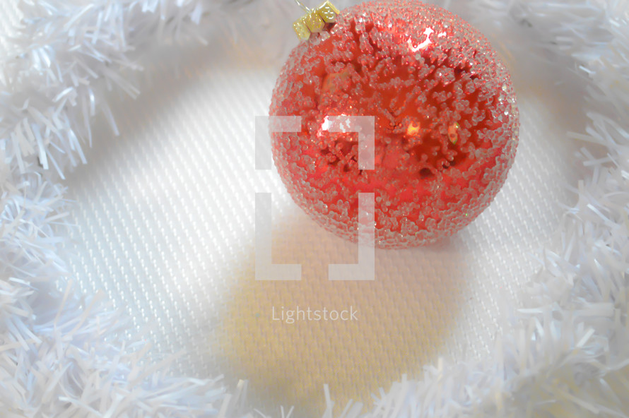 red Christmas ball ornament on white 