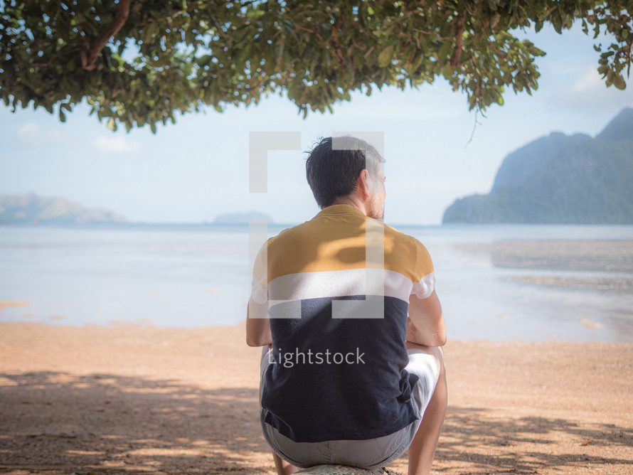 Man thinking on the beach