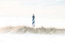 lighthouse and sandy beach 