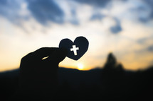 silhouette of a heart with a cross 