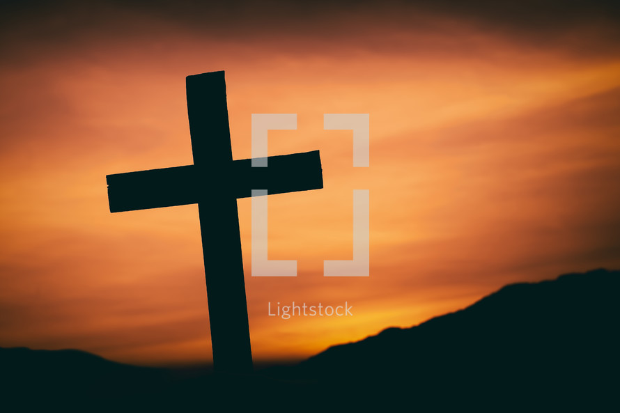 silhouette of a cross at sunset 