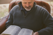 Man reading the Bible.