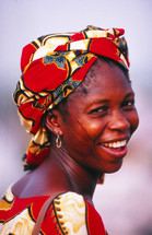 African woman in traditional clothing with face scarification or markings