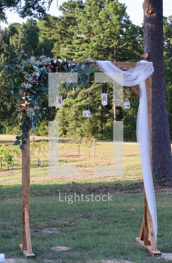 arch at an outdoor wedding 