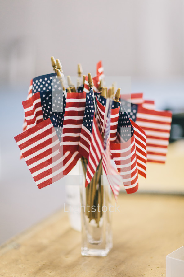 small American flags in a cup 