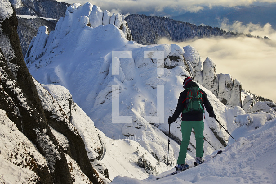Skier man in safe ski equipment in Ciucas Mountains, Romania