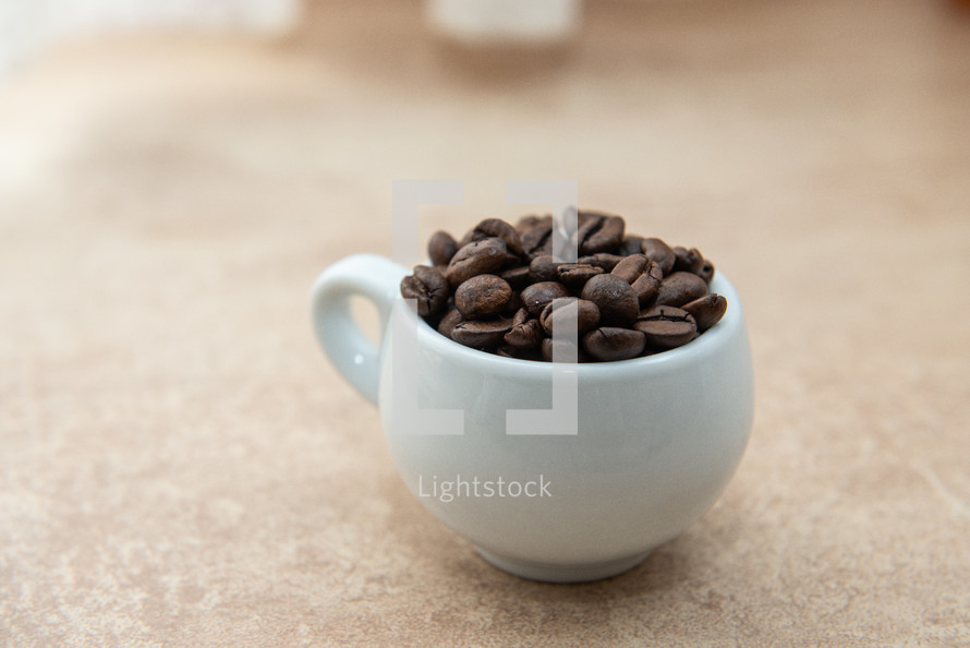 coffee beans in a coffee cup 