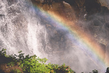 rainbow over the mist from a waterfall 