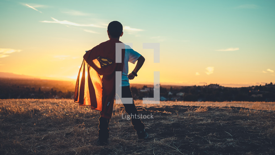 Boy facing the sun, wearing a superman cape, looking determined.
Imagination | Dreaming | Destiny | Vision| Heroes | Justice | Kids Ministry | Movies | Heroes | Bravery | Brave | Courage | Courageous | Strong | Strength | Stand | Determination | Persevere | Sermon Series |
