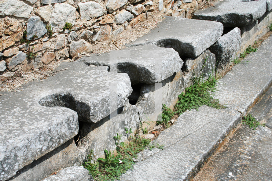 These are the public toilets at the ruins from Ancient Philippi. These toilets date to the 3rd century AD. Philippi was the home of Lydia the merchant who befriended the Apostle Paul in Acts 16 of the Bible. 