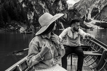 a couple cuddling on a rowboat 