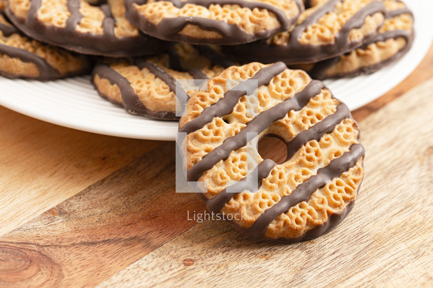 Fudge Striped Shortbreak Cookies on a Wooden Kitchen Table