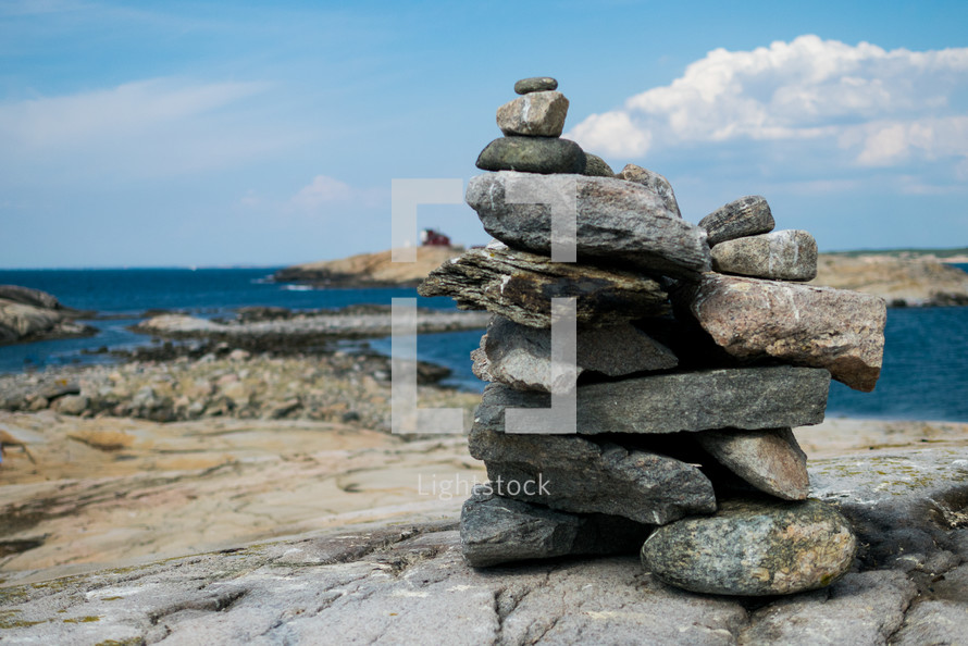 stacked rocks on a shore 
