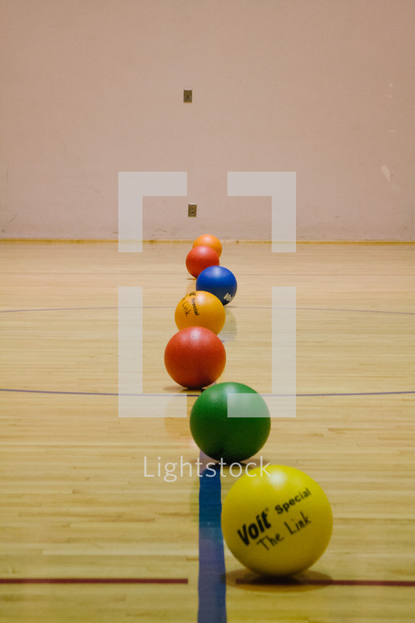 dodge balls lined up 